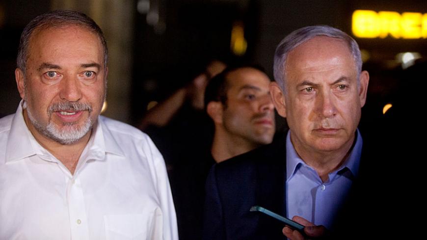 TEL AVIV, ISRAEL - JUNE 08: Israeli Prime Minister Benjamin Netanyahu (R) and Defence Minister Avigdor Liberman speak to the press at the scene of a shooting outside Max Brenner restaurant in Sarona Market on June 8, 2016 in Tel Aviv, Israel. According to police reports, four Israelis were killed and several others wounded when two Palestinian gunmen open fire at the food and retail complex in central Tel Aviv. (Photo by Lior Mizrahi/Getty Images)