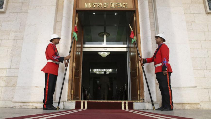Iraqi guards stand in front of the Ministry of Defence during a visit from U.S. Secretary of Defense Chuck Hagel, in Baghdad December 9, 2014. U.S. Defense Secretary Chuck Hagel arrived in Baghdad on Tuesday as the United States expands its presence and touts progress against Islamic State militants four months after starting a campaign of air strikes in Iraq.  REUTERS/Mark Wilson/Pool (IRAQ - Tags: POLITICS MILITARY) - RTR4HCSE