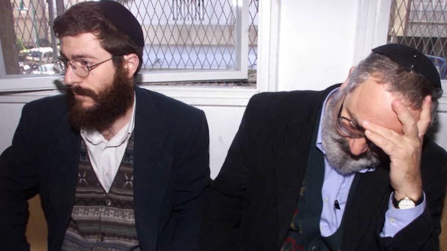 Eli Cohen, (R) and Avihai Weinstein, (L), sit handcuffed at the magistrates court in the Israeli town of Petah Tikva February 2. The court on Wednesday extended the detention of the two Israelis arrested on suspicion of selling large amounts of military equipment to Iran.
HL/FMS - RTRVL3