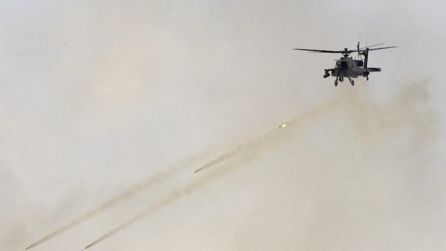 An aircraft fires missiles during the Northern Thunder exercises, in Hafr Al-Batin, near Saudi Arabia's border with Iraq, March 10, 2016. REUTERS/Abedullah al-Desori EDITORIAL USE ONLY. NO RESALES. NO ARCHIVE - RTSA6JM