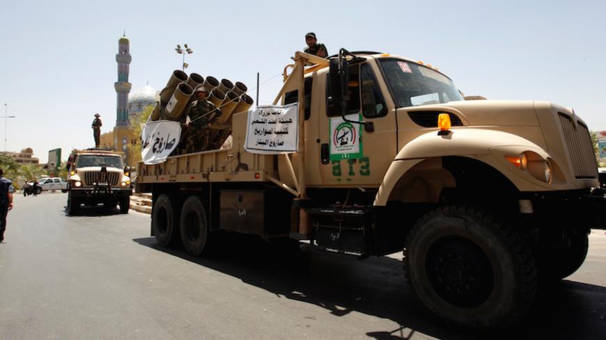 Vehicles of the Hashid Shaabi (Popular Mobilization) take part in a military parade in the streets of Baghdad, Iraq July 12, 2016. REUTERS/Khalid al Mousily - RTSHJ8D