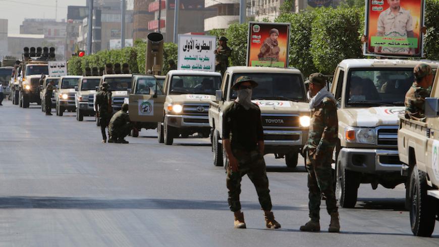 Vehicles of the Hashid Shaabi (Popular Mobilization) take part in a military parade in the streets of Baghdad, Iraq July 12, 2016. REUTERS/Khalid al Mousily - RTSHJ8G