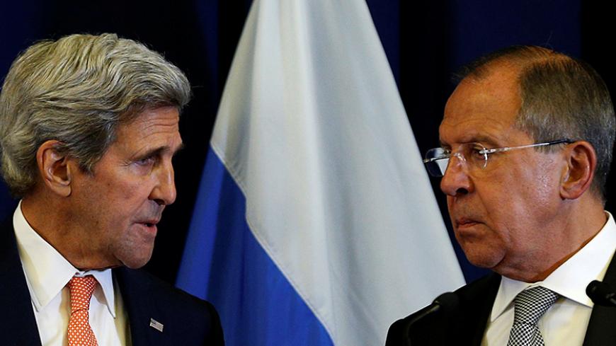 U.S. Secretary of State John Kerry and Russian Foreign Minister Sergei Lavrov look toward one another during a press conference following their meeting in Geneva, Switzerland where they discussed the crisis in Syria September 9, 2016.REUTERS/Kevin Lamarque - RTSN26D
