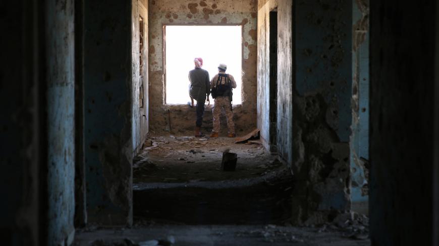 Rebel fighters stand in a damaged building in Quneitra countryside, Syria September 10, 2016. REUTERS/Alaa Al-Faqir     TPX IMAGES OF THE DAY      - RTSN5B5