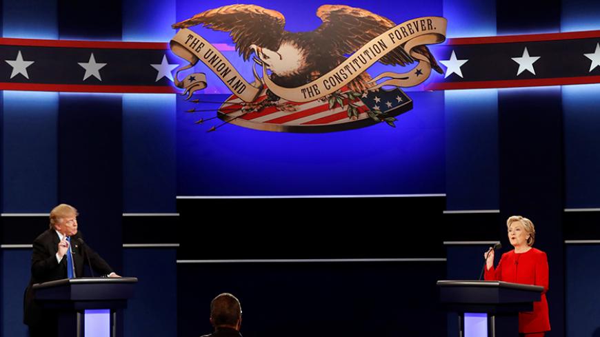 Republican U.S. presidential nominee Donald Trump and Democratic U.S. presidential nominee Hillary Clinton speak at their first presidential debate at Hofstra University in Hempstead, New York, U.S., September 26, 2016. Picture taken September 26, 2016. REUTERS/Mike Segar - RTSPO3Q