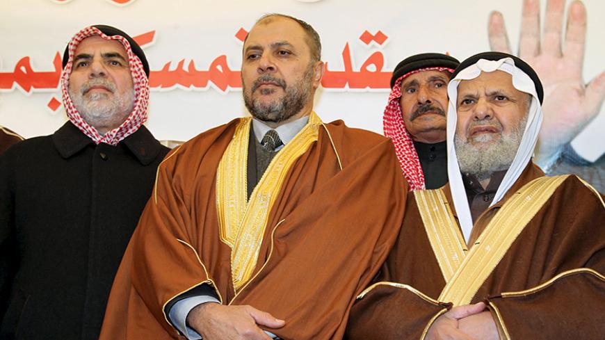 Zaki Bani Ersheid (C), deputy Secretary General of the Muslim Brotherhood, is received by supporters after his release from prison in Amman, Jordan, January 4, 2016. Jordan released Bani Ersheid after he served over two-thirds of his 18-month prison term for criticizing the United Arab Emirates. REUTERS/Majed Jaber - RTX20YKA
