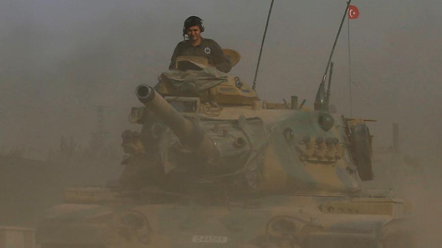 A Turkish army tank drives towards to the border in Karkamis on the Turkish-Syrian border in the southeastern Gaziantep province, Turkey, August 25, 2016. REUTERS/Umit Bektas - RTX2MYVZ
