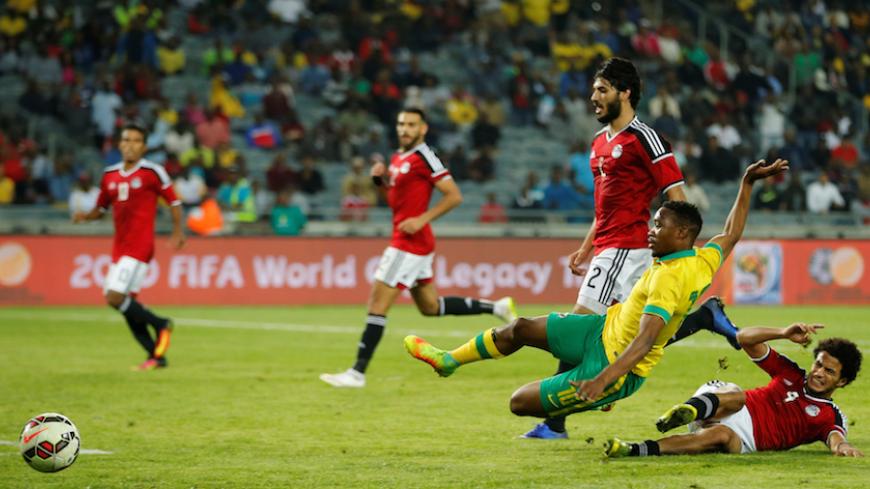 Football Soccer - South Africa v Egypt - Nelson Mandela Challenge soccer match - Orlando Stadium, Soweto, South Africa - 6/9/16 South Africa's Sibusiso Vilakazi (L) is tackled by Egypt's Omar Gaber. REUTERS/Siphiwe Sibeko - RTX2OEK5