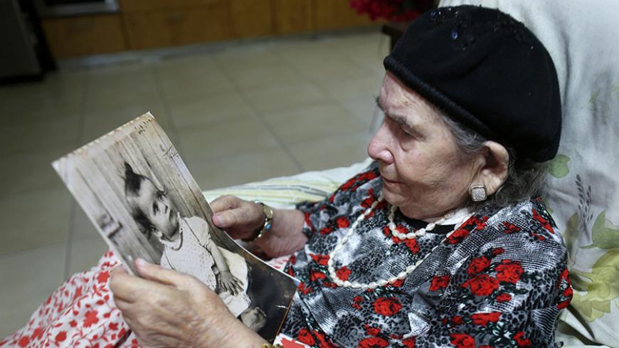 Frecha Amar, 84, from a Moroccan descent, poses with a picture of her baby, who she says was abducted in 1958, on June 29, 2016 at her home in Kfar Chabad, near Tel-Aviv.
Amar is one of the thousands of Israelis, mainly from Jewish Yemenite families, who claim their babies were abducted more than 60 years ago and handed to adoption. Such stories of babies from immigrant families disappearing have been told in Israel for decades, but growing calls to unseal official documents on the allegations mean new lig