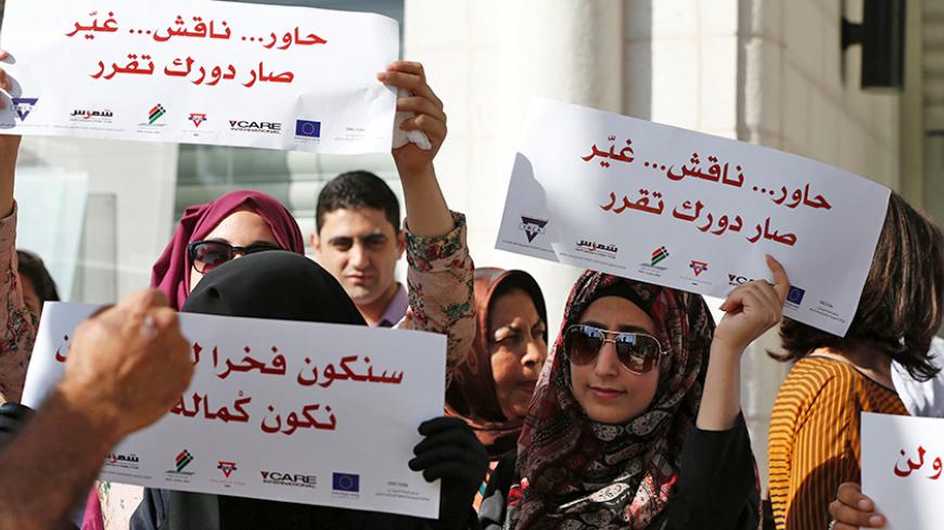 Palestinians demonstrate in front of the hight court in the West Bank city of Ramallah calling authorities not to postpone local elections,  on September 21, 2016. 
Palestinian municipal polls scheduled for October 8 were officially postponed after a court delayed a ruling on whether to hold the first vote since 2006 to include both Fatah and Hamas.

 / AFP / ABBAS MOMANI        (Photo credit should read ABBAS MOMANI/AFP/Getty Images)
