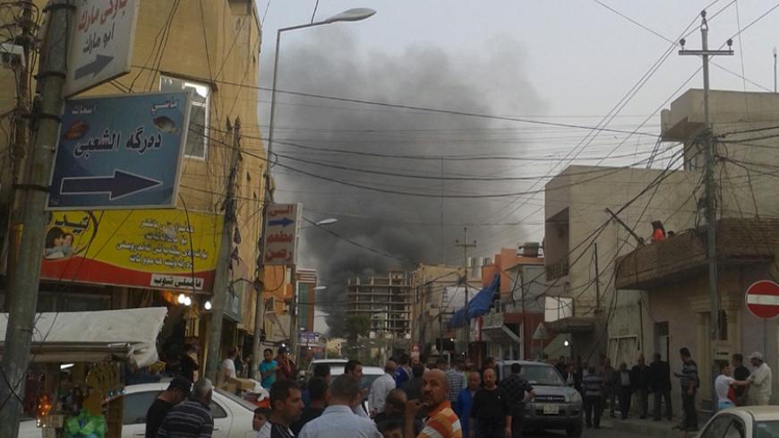 Smoke rises from the site of a bomb attack in Erbil, the capital of Iraq's Kurdistan region, April 17, 2015. A car bomb exploded on a road outside the U.S. Consulate and compound in Erbil on Friday, a Reuters witness said. The consulate houses U.S. diplomats and staff but there was no immediate reports of casualties. Gunfire was heard immediately after the blast but stopped later, the witness said. REUTERS/Stringer - RTR4XRWU
