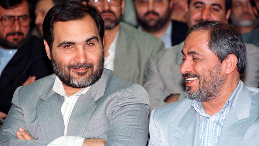 Mohammad Forouzandeh (L), new chairman of the Foundation for the Disinherited and War Disabled, sits with outgoing chairman Mohsen Rafiqdoost (R) during the innauguration ceremony in Tehran July 28. Foroozandeh says he plans to make the sprawling foundation more efficient and cost effective.

JDP - RTRQNR6