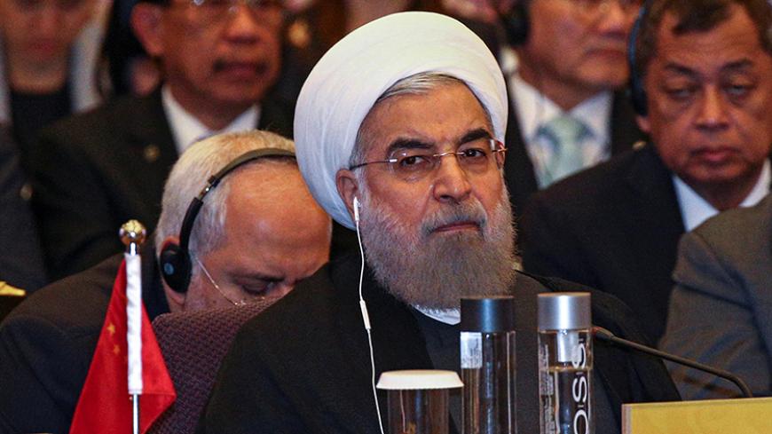 Iran's President Hassan Rouhani attends a meeting during the Asia Cooperation Dialogue (ACD) summit at the Foreign Ministry in Bangkok, Thailand, October 10, 2016. REUTERS/Athit Perawongmetha - RTSRK1N