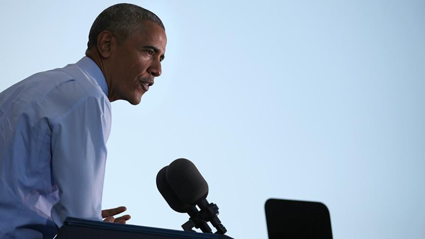U.S. President Barack Obama speaks during a campaign event for U.S. Democratic presidential candidate Hillary Clinton in Greensboro, North Carolina, U.S. October 11, 2016.  REUTERS/Carlos Barria - RTSRUFF