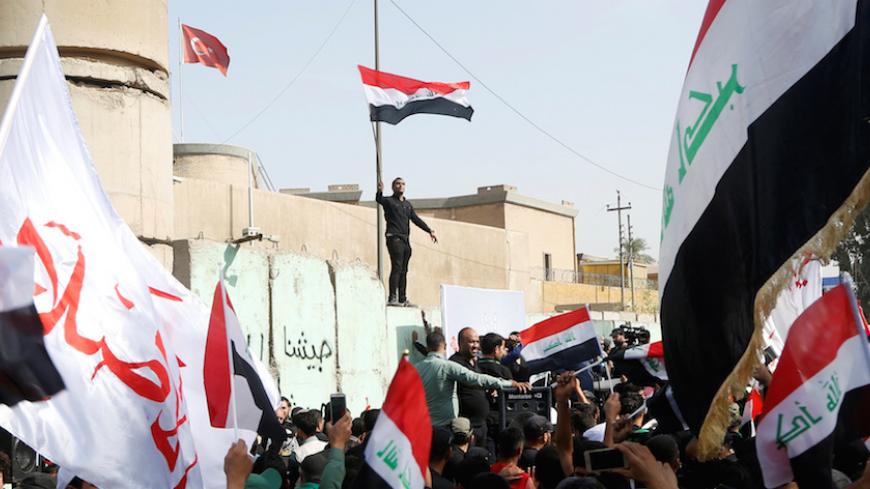 Supporters of Iraqi Shi'ite cleric Moqtada al-Sadr shout slogans during an anti-Turkey protest in front of the Turkish embassy in Baghdad, Iraq October 18, 2016.  REUTERS/Wissm al-Okili - RTX2PACJ