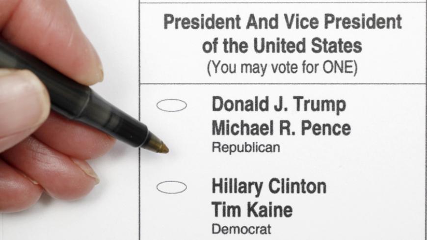 A sample ballot is seen in a photo illustration, as early voting for the 2016 general elections began in North Carolina, in Chapel Hill, North Carolina, U.S. October 20, 2016.   REUTERS/Jonathan Drake - RTX2PS45