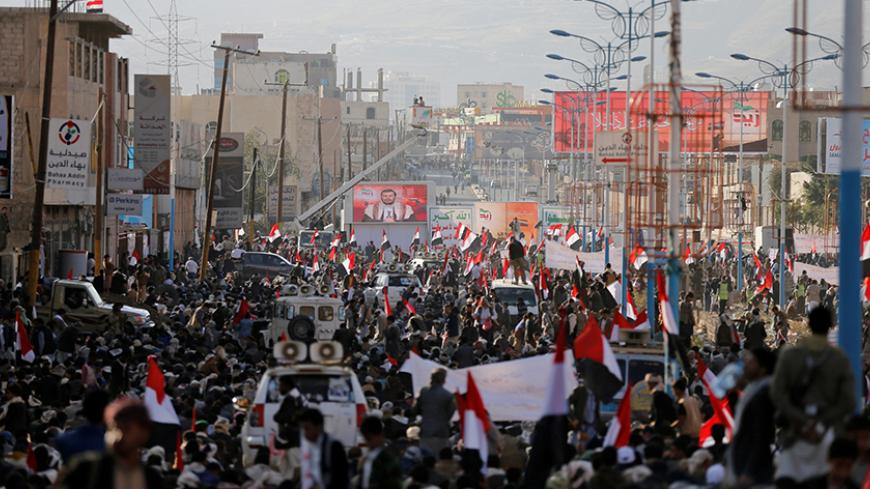 Houthi followers watch as their leader Abdul-Malik al-Houthi delivers a speech during a rally commemorating the death of Imam Zaid bin Ali in Sanaa, Yemen October 26, 2016. REUTERS/Khaled Abdullah - RTX2QLC8
