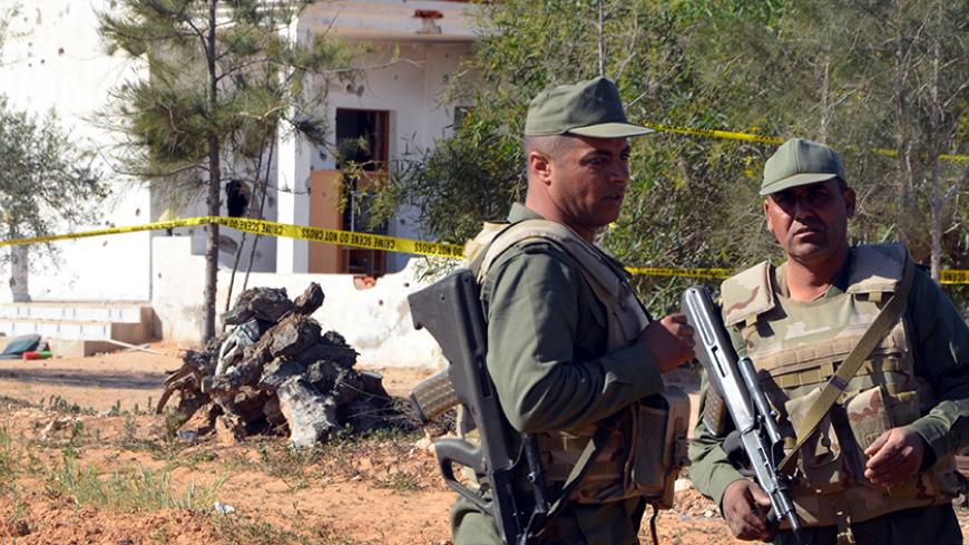 Tunisian soldiers stand guard at the scene of an assault on a house outside the town of Ben Guerdane near the border with Libya on March 3, 2016.
Five militants who were killed by Tunisian forces near the Libyan border had slipped across with the intention of carrying out "terrorist attacks", Prime Minister Habib Essid said.

 / AFP / FATHI NASRI        (Photo credit should read FATHI NASRI/AFP/Getty Images)