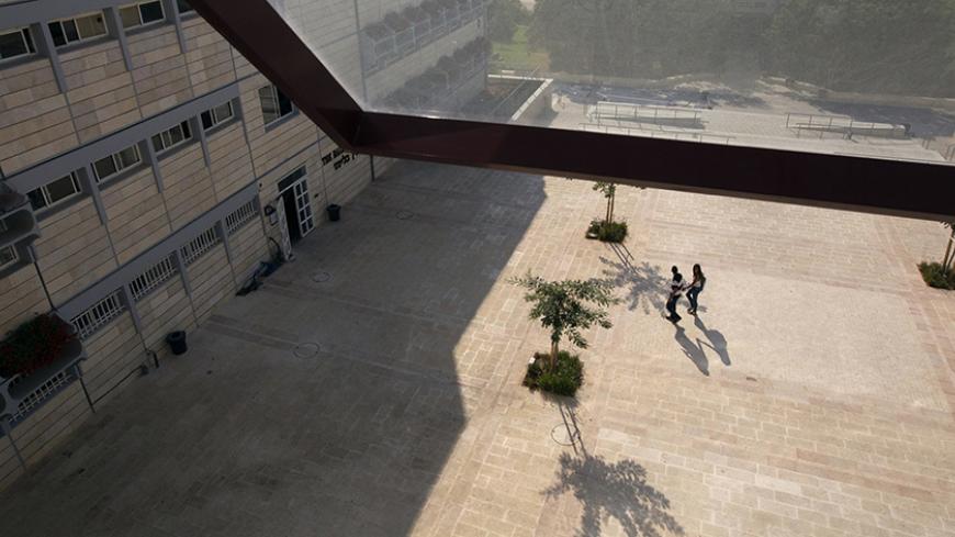 Students walk at the campus of the Ariel University Centre in the West Bank Jewish settlement of Ariel September 13, 2012. An Israeli government move to upgrade Ariel University Centre in the occupied West Bank to a full-fledged university has put the 30-year-old school at the centre of a debate at the core of the Israeli-Palestinian conflict: how the settlements will figure in defining a future Palestinian state. Picture taken September 13, 2012. To match Feature PALESTINIANS-ISRAEL/SETTLEMENTS REUTERS/Ro