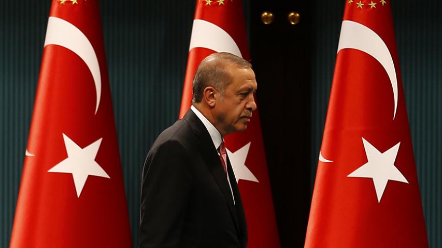Turkish President Tayyip Erdogan leaves after a news conference following the National Security Council and cabinet meetings at the Presidential Palace in Ankara, Turkey, July 20, 2016.  REUTERS/Umit Bektas  TPX IMAGES OF THE DAY - RTSIXEM