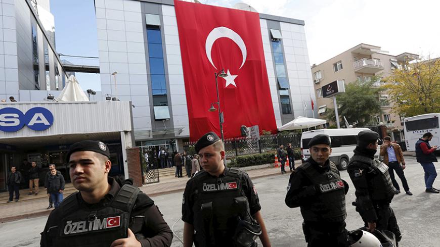 Riot police stand guard outside the Kanalturk and Bugun TV building in Istanbul, Turkey, October 28, 2015. Turkish police on Wednesday stormed the offices of an opposition media company, days before an election, in a crackdown on companies linked to a U.S.-based cleric and foe of President Tayyip Erdogan, live footage showed. Brawls broke out and police sprayed water cannon to disperse dozens of people in front of the offices of Kanalturk and Bugun TV in Istanbul, a live broadcast on Bugun's website showed.