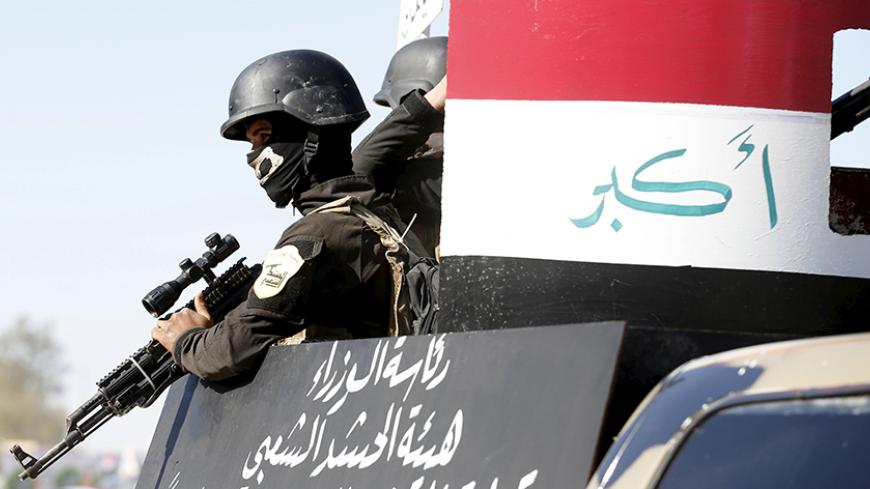 Iraqi Sunni Muslim fighters from Hashid Shaabi (Popular Mobilization) take part in a parade during a ceremony marking the Iraqi Police Day at Amiriyat al-Fallujah in Anbar province, January 9, 2016. REUTERS/Thaier Al-Sudani - RTX21NHJ