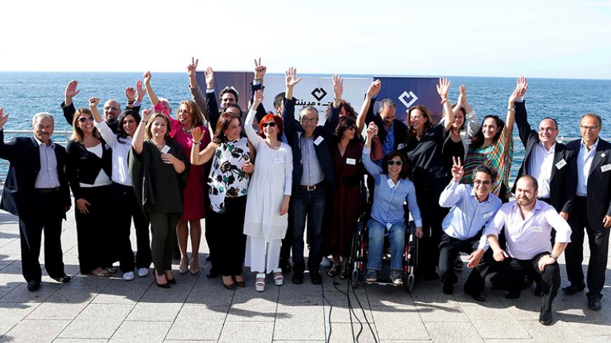 Beirut Madinati candidates and activists gesture after announcing their list of candidates for the municipality elections in Beirut, Lebanon, April 22, 2016. Picture taken April 22, 2016. REUTERS/Mohamed Azakir - RTX2CZSS