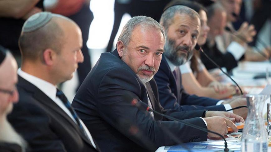 Israel defense minister, Avigdor Lieberman (C) during a special Cabinet meeting to mark Jerusalem Day in Ein Lavan spring located in the outskirts of Jerusalem ,02 June 2016. REUTERS/Abir Sultan/Pool - RTX2FADS