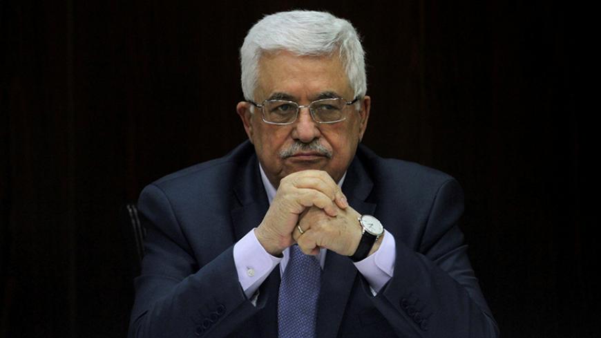 Palestinian President Mahmoud Abbas heads a Palestinian cabinet meeting in the West Bank city of Ramallah July 28, 2013. REUTERS/Issam Rimawi/Pool/File Photo - RTX2O7X6