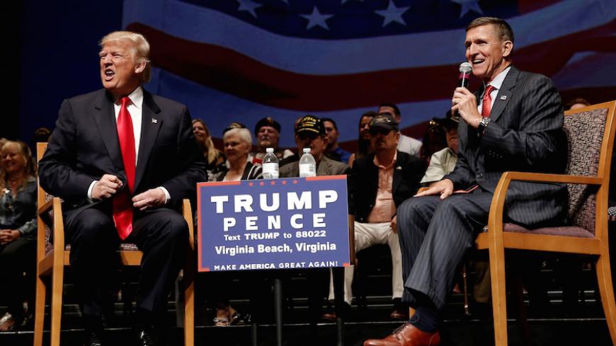Republican presidential nominee Donald Trump (L) speaks along side retired U.S. Army Lieutenant  General Mike Flynn during a campaign town hall meeting in Virginia Beach, Virginia, U.S., September 6, 2016.  REUTERS/Mike Segar - RTX2OE6J