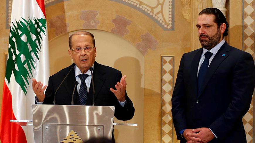 Christian politician and FPM founder Michel Aoun (L) talks during a news conference next to Lebanon's former prime minister Saad al-Hariri after he said he will back Aoun to become president in Beirut, Lebanon October 20, 2016. REUTERS/Mohamed Azakir - RTX2PR3I