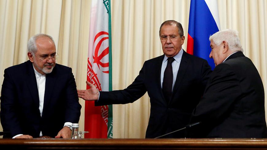 Russian Foreign Minister Sergei Lavrov (C) and his counterparts Walid al-Muallem (R) from Syria and Mohammad Javad Zarif from Iran attend a news conference in Moscow, Russia, October 28, 2016. REUTERS/Sergei Karpukhin - RTX2QU34