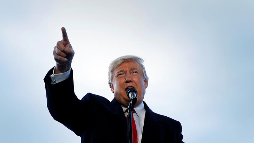 U.S. Republican presidential nominee Donald Trump attends a campaign event in Wilmington, Ohio, U.S. November 4,  2016.   REUTERS/Carlo Allegri - RTX2RZEN