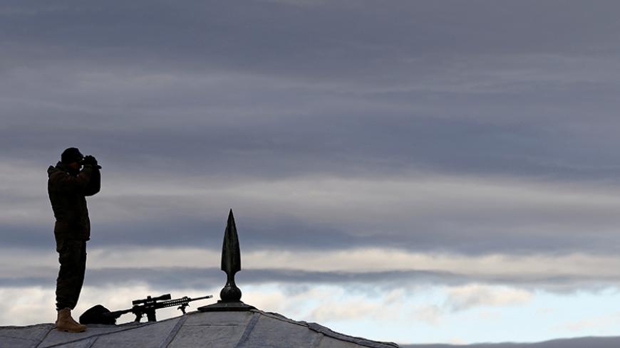 A police special forces member stands on top of a roof as part of security measures during a ceremony at the mausoleum of Mustafa Kemal Ataturk, marking the anniversary of his death, in Ankara, Turkey November 10, 2016.  REUTERS/Umit Bektas  - RTX2SYFC