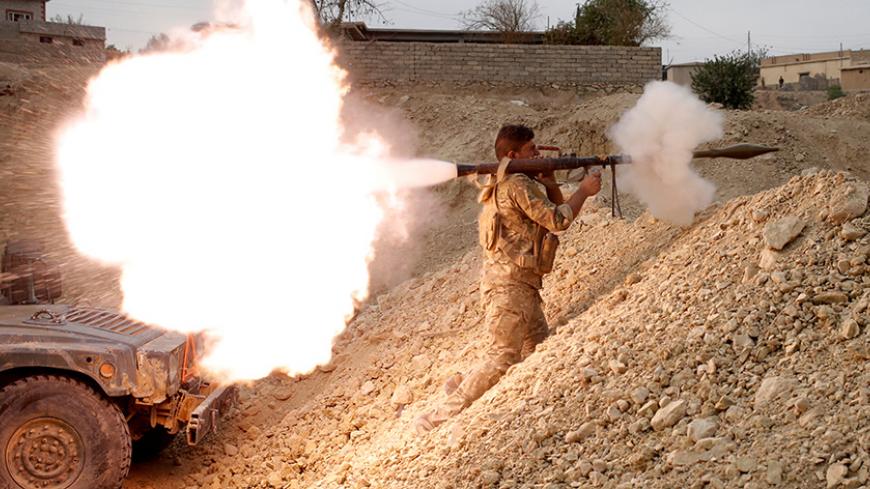 An Iraqi soldier fires a RPG in Karamah, south of Mosul, Iraq November 10, 2016. REUTERS/Goran Tomasevic      TPX IMAGES OF THE DAY      - RTX2T169