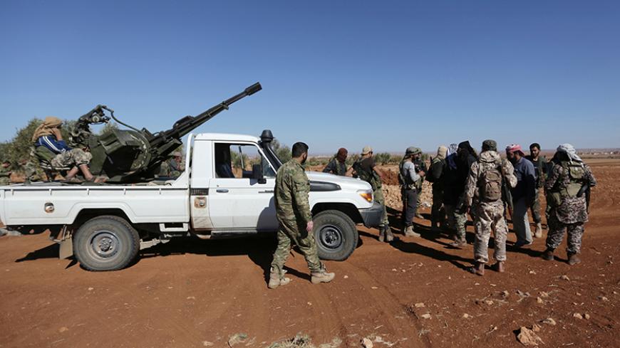 Rebel fighters gather during their advance towards the Islamic State-held city of al-Bab, northern Syria October 26, 2016. Picture taken October 26, 2016. REUTERS/Khalil Ashawi - RTX2TKNU