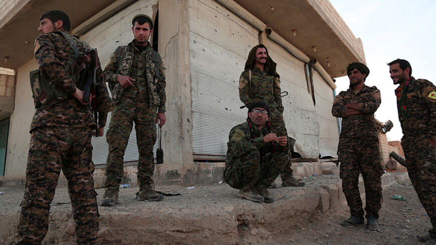 Syrian Democratic Forces (SDF) fighters gather in the town of Hisha after they took control of the area from Islamic State militants, in the northern Raqqa countryside, Syria November 14, 2016. REUTERS/Rodi Said - RTX2TNGI
