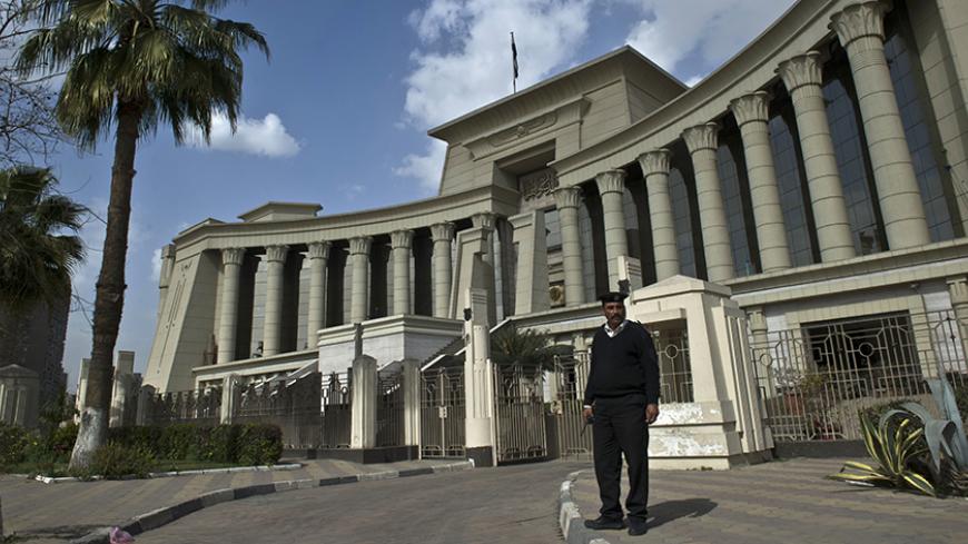 An Egyptian policeman stands guard outside the Supreme Constitutional Court in Cairo on February 25, 2015 during a court session to determine if the House of Representatives parliamentary election law is constitutional. Egypt's Constitutional Court said it will rule on March 1 whether the country's election law is constitutional, a verdict that could alter the schedule of the upcoming parliamentary polls. AFP PHOTO / KHALED DESOUKI        (Photo credit should read KHALED DESOUKI/AFP/Getty Images)