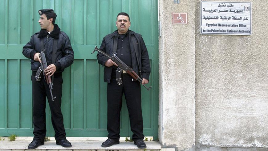 GAZA CITY, GAZA STRIP - FEBRUARY 9: Palestinians policemen stand guard in front of Egypt embassy, February 9, 2006 in Gaza City, Gaza Strip. Earlier Palestinian gunmen abducted an Egyptian diplomat, Hussam al-Mawsili, on a Gaza street, witnesses said. (Photo by Ahmad Khateib/ Getty Images)