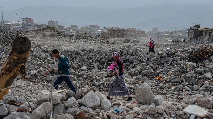 People arrive at Sirnak city on November 14, 2016 after a 246-day curfew was partially lifted.
The curfew in Sirnak, a city of 290,000, was imposed on March 14 as part of operations to eradicate the PKK from eastern Turkey. / AFP / ILYAS AKENGIN (Photo credit should read ILYAS AKENGIN/AFP/Getty Images)