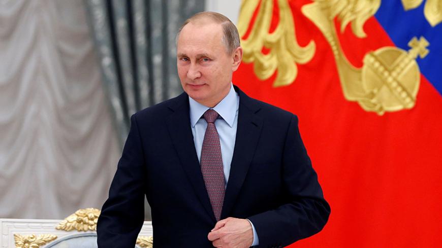 Russian President Vladimir Putin attends a meeting of the Presidential Council for Strategic Development and Priority Projects at the Kremlin in Moscow, Russia, November 25, 2016. REUTERS/Sergei Ilnitsky/Pool - RTST9DD