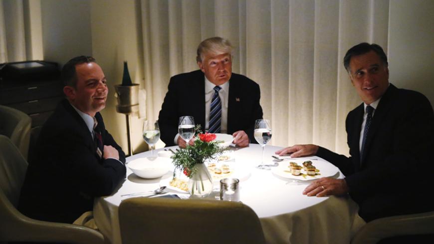 U.S. President-elect Donald Trump sits at a table for dinner with former Massachusetts Governor Mitt Romney (R) and his choice for White House Chief of Staff Reince Priebus (L) at Jean-Georges at the Trump International Hotel & Tower in New York, U.S., November 29, 2016. REUTERS/Lucas Jackson - RTSTX8X