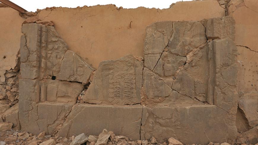 Remains of wall panels and colossal statues of winged bulls, destroyed by Islamic State militants are seen in the Assyrian city of Nimrud eastern bank of the Tigris River, south of Mosul, Iraq, November 16, 2016. REUTERS/Ari Jalal - RTX2TYP9