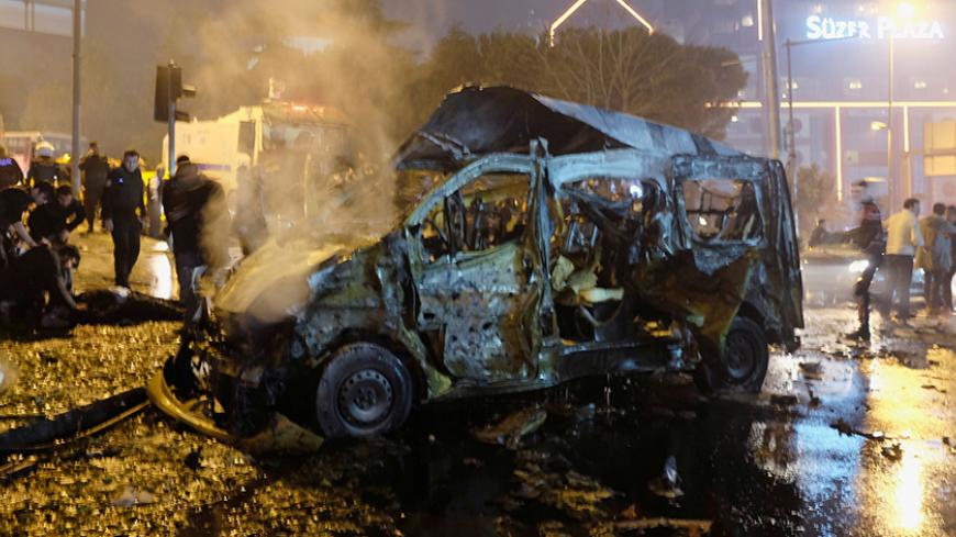 A damaged vehicle is seen after a blast in Istanbul, Turkey, December 10, 2016. REUTERS/Murad Sezer - RTX2UGLB