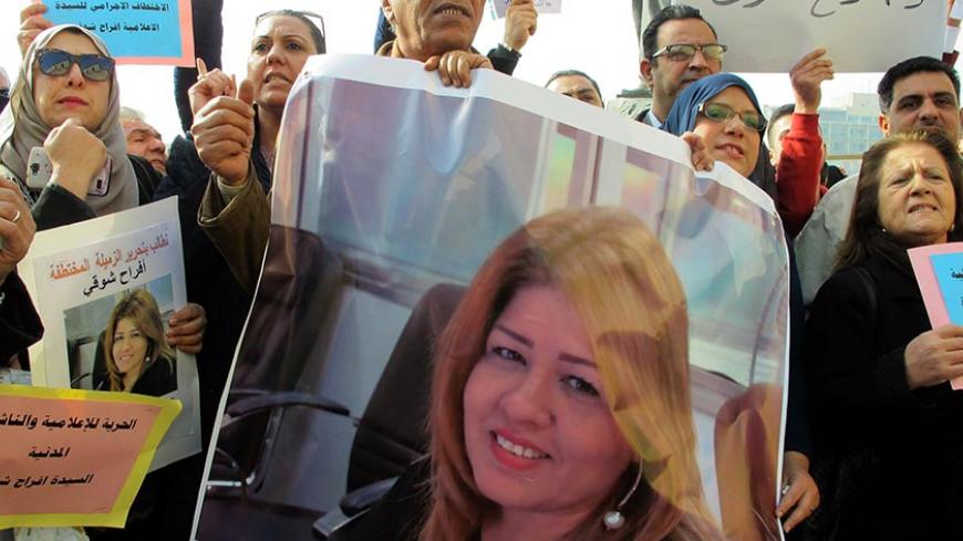 Protesters hold protraits of Iraqi female journalist Afrah Shawqi during a demonstration calling for her release on December 30, 2016, in Baghdad.
Shawqi, 43, who is employed by Asharq al-Awsat, a London-based pan-Arab newspaper, was abducted on December 26, 2016, from her home in a southern neighbourhood of the Iraqi capital. / AFP / SABAH ARAR        (Photo credit should read SABAH ARAR/AFP/Getty Images)