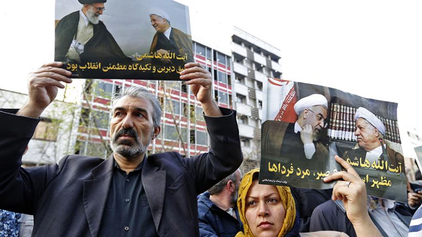 Iranians hold posters of late former Iranian President Akbar Hashemi Rafsanjani during his funeral ceremony in the capital Tehran, on January 10, 2017.
The heavyweight politician, who died on January 8 at the age of 82, will be buried inside the crypt of Ayatollah Ruhollah Khomeini, the leader of Iran's 1979 Islamic revolution, at Khomeini's mausoleum is in south Tehran.
/ AFP / ATTA KENARE (Photo credit should read ATTA KENARE/AFP/Getty Images)