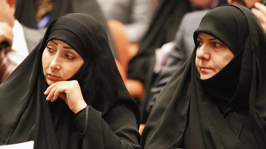 Members of the new Iraqi parliament attend a session at the parliament headquarters in Baghdad July 1, 2014. Newly elected Iraqi lawmakers convene on Tuesday, under pressure to name a unity government to keep the country from splitting apart after an onslaught by Sunni Islamists who have declared a "caliphate" to rule over all the world's Muslims.   REUTERS/Thaier Al-Sudani  (IRAQ - Tags: POLITICS) - RTR3WMTV