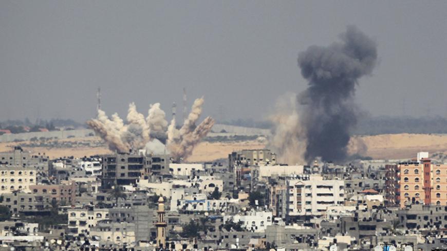 Smoke rises following what witnesses said were Israeli air strikes in Gaza August 23, 2014. Israeli aircraft bombed the Gaza Strip on Saturday and Palestinian militants fired rockets at the Jewish state, the military said, with no end in sight to the deadliest violence between the sides in years.     REUTERS/Ahmed Zakot (GAZA - Tags: POLITICS CIVIL UNREST CONFLICT TPX IMAGES OF THE DAY) - RTR43GTS