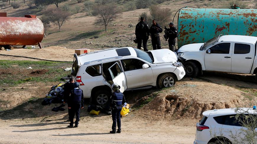 A car (L), which Israeli police said was used by an Arab Israeli to ram into a group of policemen, is seen at the scene of the incident in Umm Al-Hiran, a Bedouin village in Israel's southern Negev Desert January 18, 2017. REUTERS/Ammar Awad - RTSW1KM