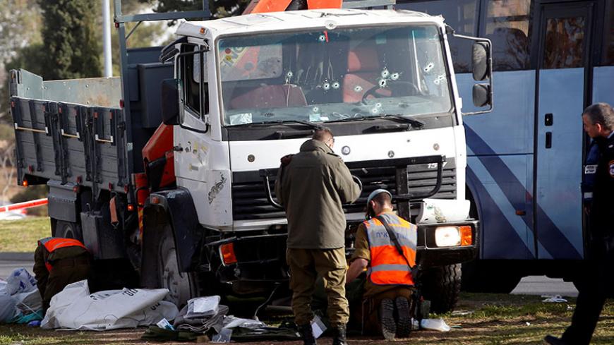 Israeli soldiers work at the scene where police said a Palestinian rammed his truck into a group of Israeli soldiers on a popular promenade in Jerusalem January 8, 2017. REUTERS/Ronen Zvulun TPX IMAGES OF THE DAY - RTX2XYKA